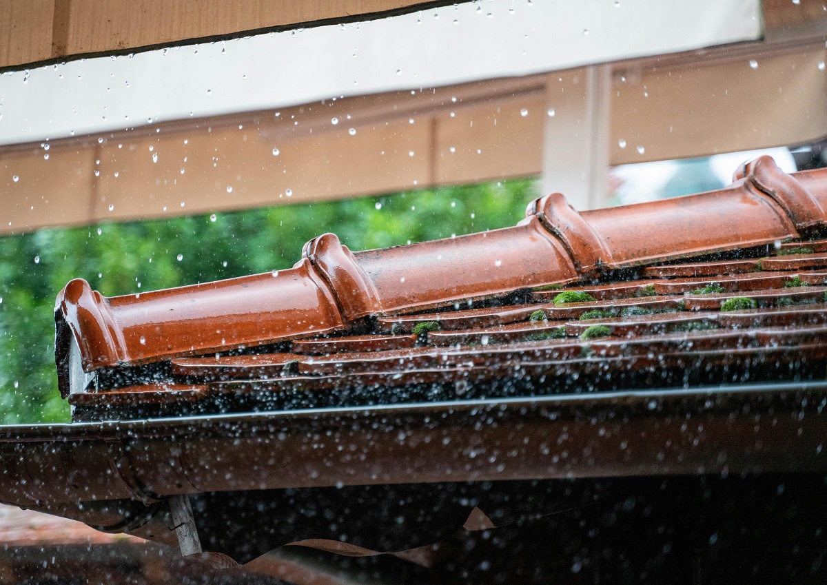 raindrops falling onto a gutter
